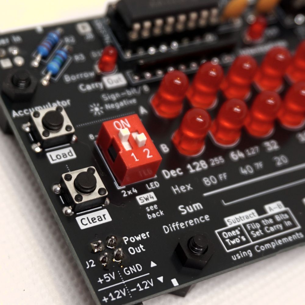 Accumulator control buttons and DIP settings of the Byte Adder Subtractor
