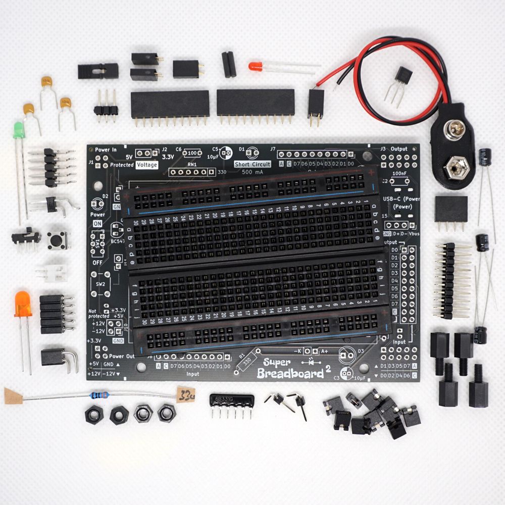 Parts that come with the Super Breadboard 2 Kit. The PCB comes with all tiny parts already assembled