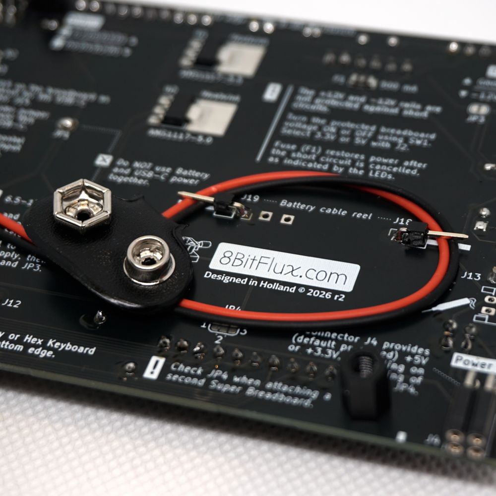Stow away the 9-volt battery clip using the cable reel